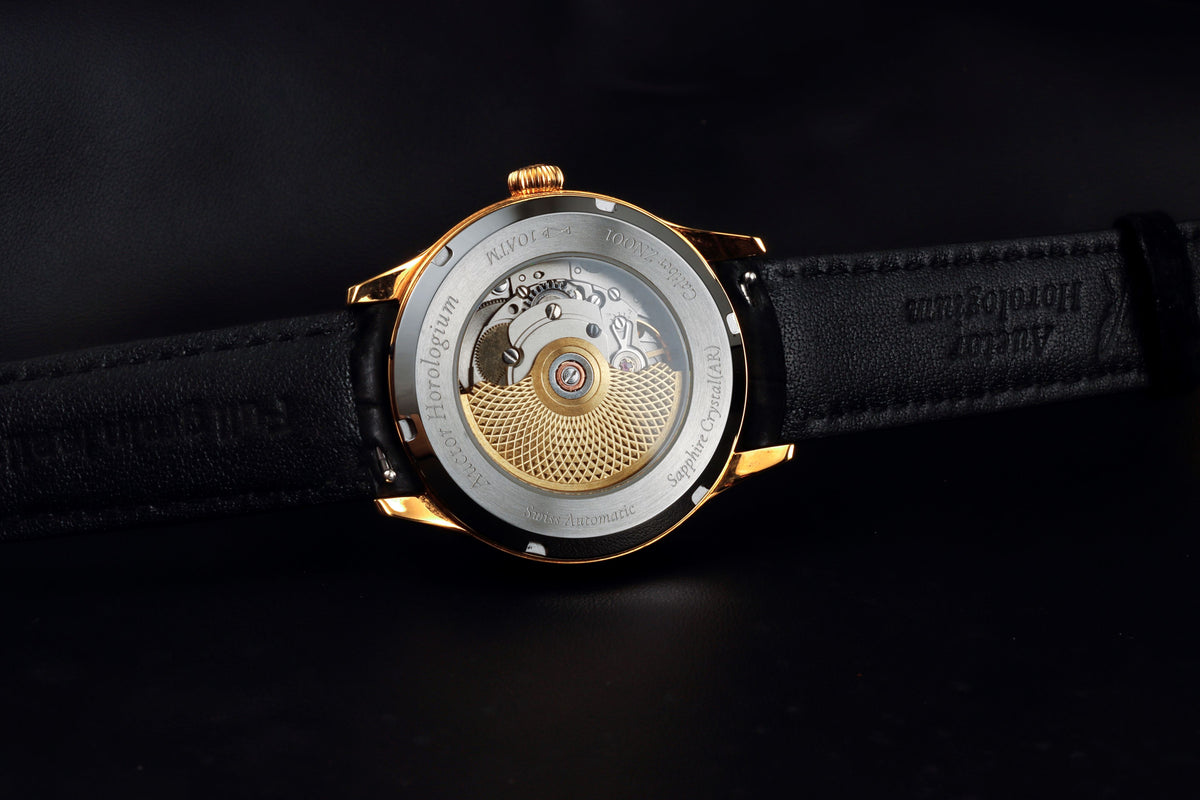 Auctor Zen exhibition caseback revealing Sellita SW200-1A automatic movement with custom rotor